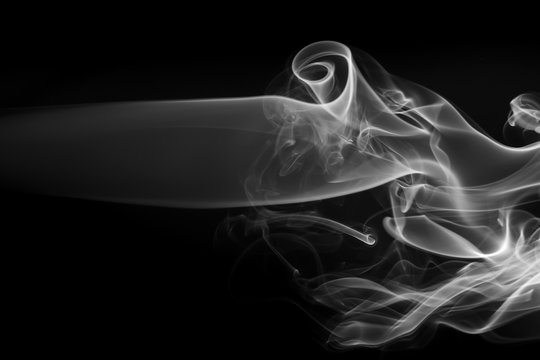 Fire fo white smoke abstract on black background for design. drakness concept