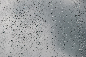 Rain drops on the glass for background and texture