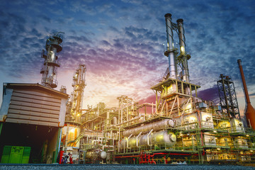Industrial furnace and heat exchanger cracking hydrocarbons in petroleum factory on sky sunset background, Manufacturing of petrochemical plant