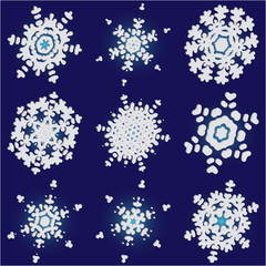 Collection of paper cut isolated snowflakes on blue background.