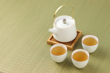 cup of tea with teapot and cup of tea