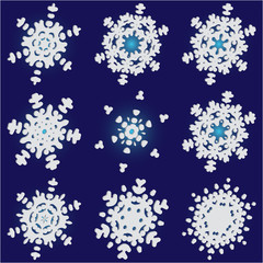 Set of christmas paper snowflakes on blue background.