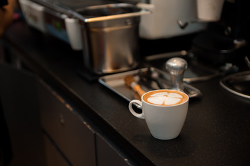 Hot coffee latte in white cup