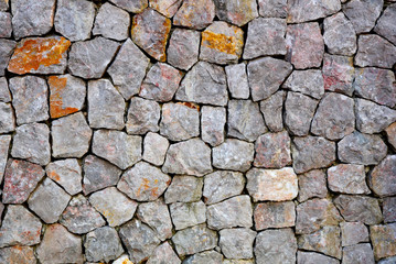Old ancient stone wall in the sunlight in the daytime,suitable to use as a background, idea copy space