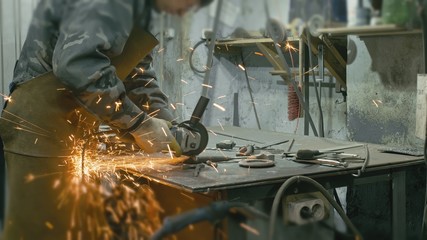 Forge workshop on table. Smithy manual production. Work on the product. Ruler, angle grinder. The...