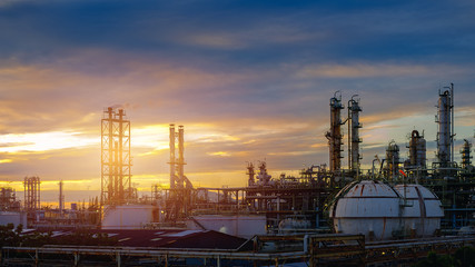 Fototapeta na wymiar Manufacturing of petroleum industrial plant on sunset sky background