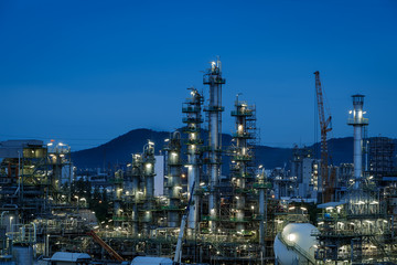 Oil and gas refinery plant or Petrochemical industrial plant on blue sky twilight background,...