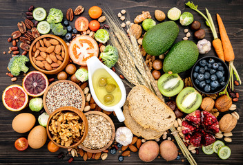Ingredients for the healthy foods selection. The concept of healthy food set up on wooden background.
