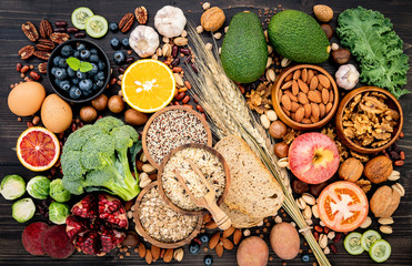 Ingredients for the healthy foods selection. The concept of healthy food set up on wooden background.