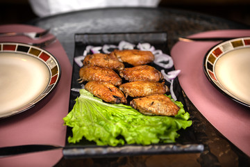 Dinner in Fancy Restaurant. Chicken Dish on the Table