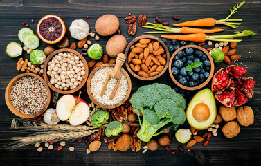 Ingredients for the healthy foods selection. The concept of healthy food set up on wooden background.