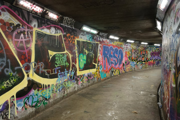 Graffiti covered walls of an underground pedestrian walkway in Belfast, Northern Ireland.
