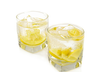Glass of ice cold lemonade isolated on white background.
