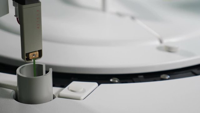 Medical Hematology analyzing machine automatically working for blood testing. Automated process of biomaterial research in modern biochemistry analyzer. Close up. Shot in 4k