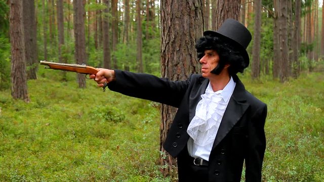 Duel: man with pistol in forest, victorian clothes