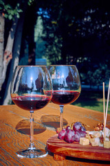 Glasses Of Fine Red Wine With Grape and Cheese