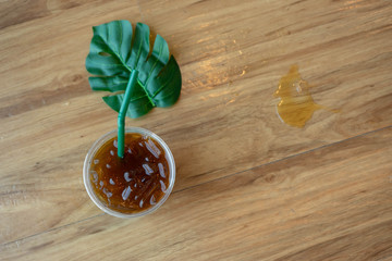 Coffee and green leaves, top view, light