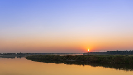 Fototapeta na wymiar Scenic View Of River Against Sky During Sunset