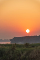 Scenic View Of Field Against Sky During Sunset