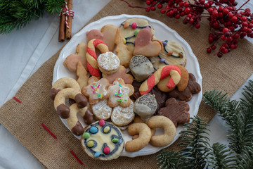 Traditional home made German Christmas Cookies on a festive christmas background