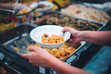 Homeless people receive free food from compassionate people: the concept of food needs