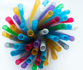 defocus. colored plastic tubules on a white background
