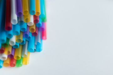 defocus. colored plastic tubules on a white background