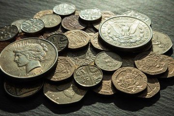 background. copper and silver coins of various denominations and values. dollar.