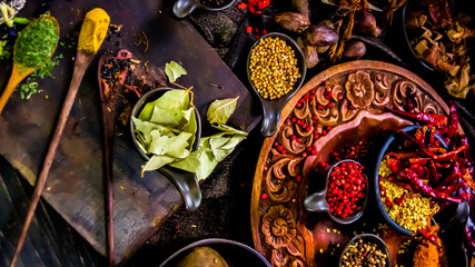 Top view Thai spices and herbs ingredient decoration on wood table for cook in home kitchen. 