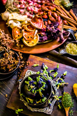 Top view Thai spices and herbs ingredient decoration on wood table for cook in home kitchen. 