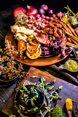 Top view Thai spices and herbs ingredient decoration on wood table for cook in home kitchen. 
