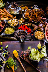 Top view Thai spices and herbs ingredient decoration on wood table for cook in home kitchen. 