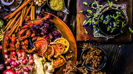 Top view Thai spices and herbs ingredient decoration on wood table for cook in home kitchen. 