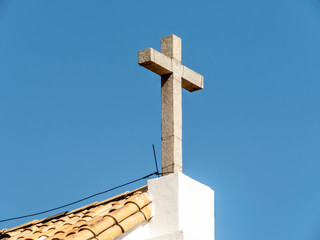cross on top roof of catholic church in Brazil