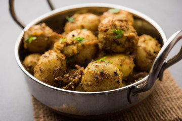 Jeera Aloo - Potatoes Flavoured With Cumin seeds and spices. popular Indian main course recipe. served in a bowl. selective focus