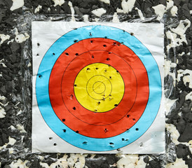 Archery target in holes from arrows
