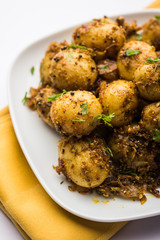 Jeera Aloo - Potatoes Flavoured With Cumin seeds and spices. popular Indian main course recipe. served in a bowl. selective focus