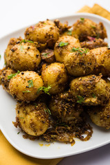 Jeera Aloo - Potatoes Flavoured With Cumin seeds and spices. popular Indian main course recipe. served in a bowl. selective focus