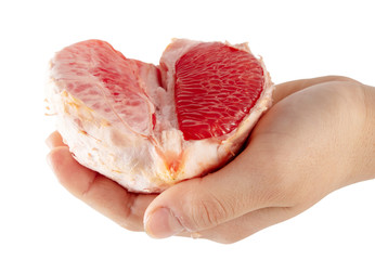Peeled pomelo in hand isolated on a white background