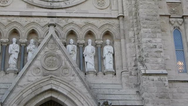 Closeup Of Statues On Grey Stone Church Building Right To Left Panorama