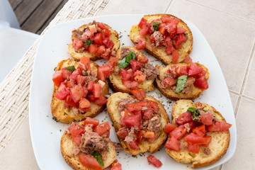 Appetizer of bruschetta with tuna