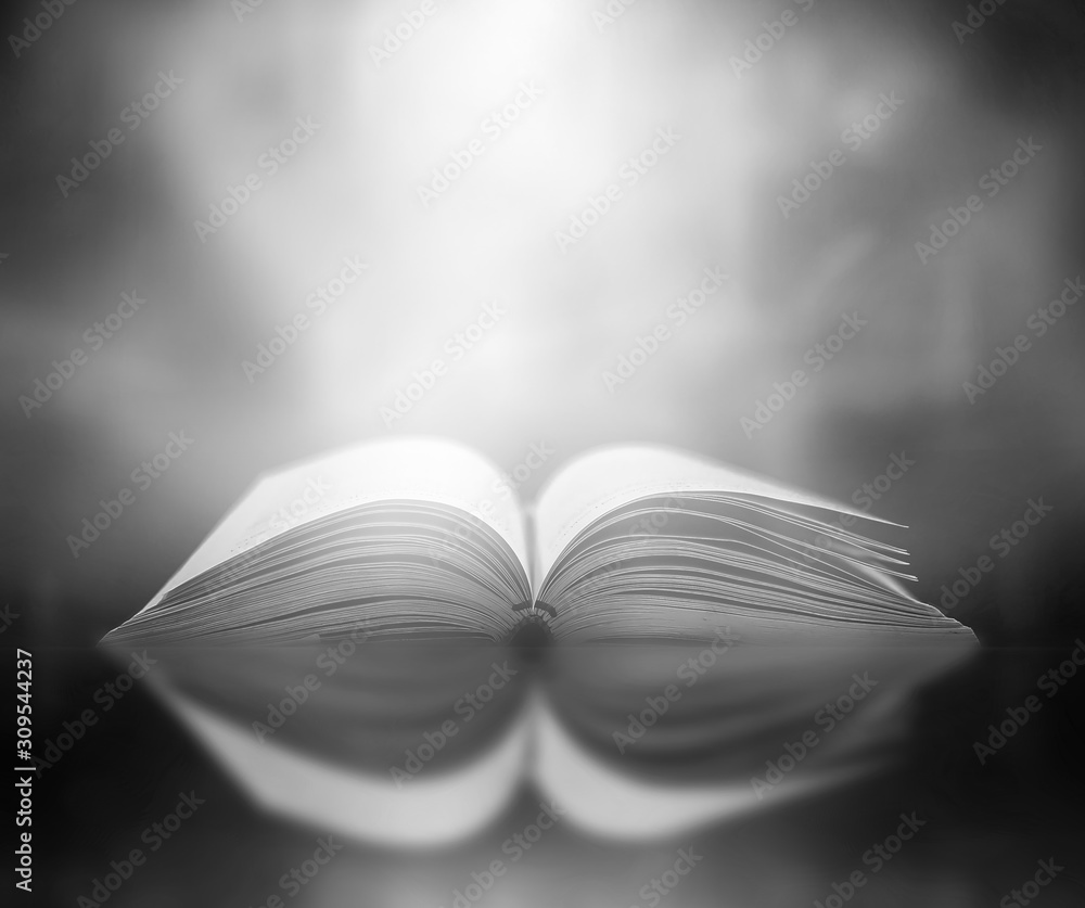 Poster imagine a picture book of an ancient book opened on a wooden table with a sparkling golden backgroun