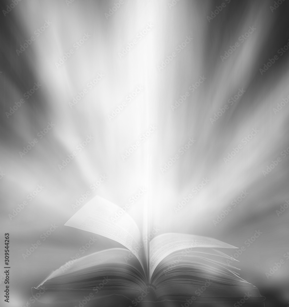 Poster imagine a picture book of an ancient book opened on a wooden table with a sparkling golden backgroun