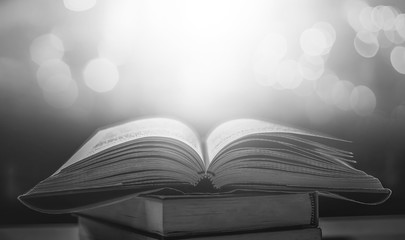 Stack of books in the library and blur bookshelf background	