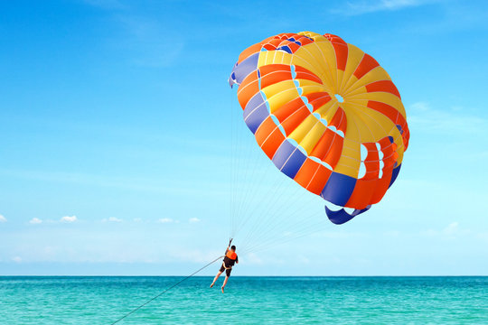 Parasailing on Tropical Beach in summer.