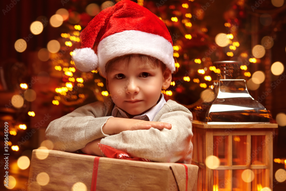 Wall mural little boy with santa hat