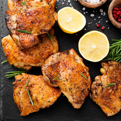 Grilled chicken thighs with spices and lemon. Top view