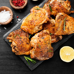 Grilled chicken thighs with spices and lemon. Top view