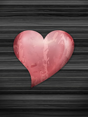 Heart on wooden backfound
