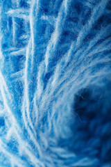 Obraz premium Wool yarn close-up colorful blue threads for needlework.